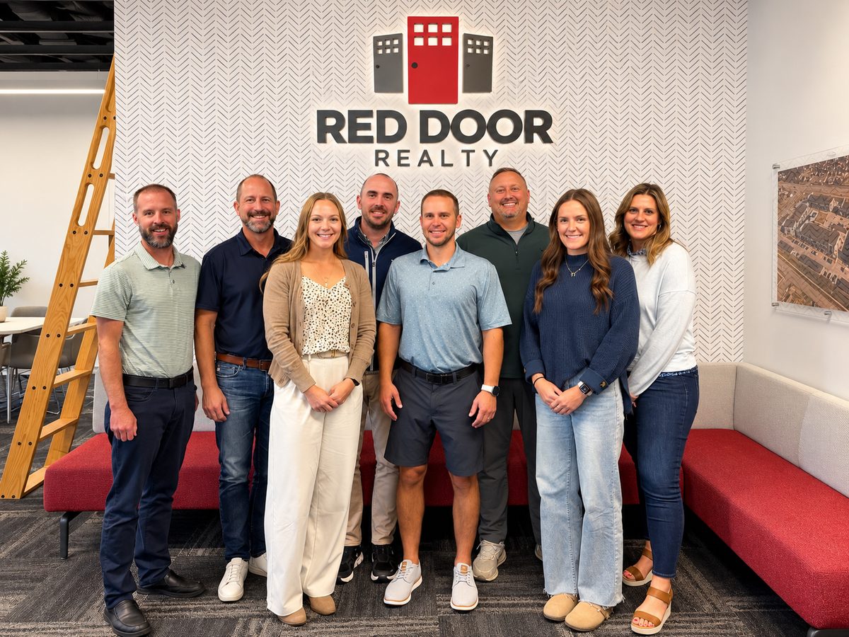 The Red Door Realty team in the office